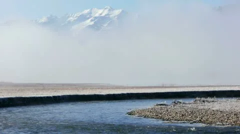 Winter River Mountains in Clouds in background Video stock 22062047