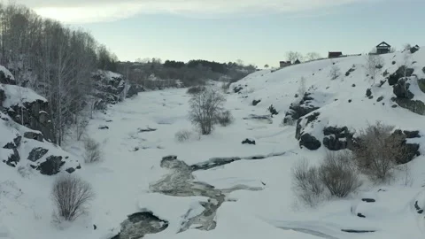 Winter river with rapids and current, flying over thawed water and flowing in Video stock 165347671
