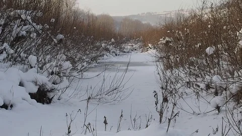 Winter river, snow on the beach. Stock Footage 82643354