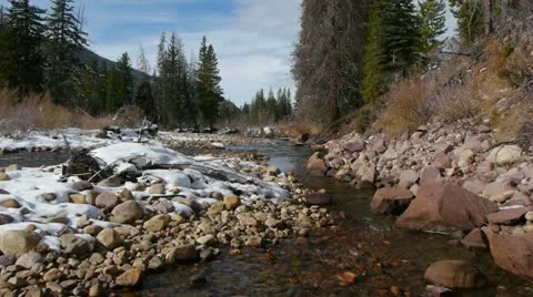 Winter river snow camera jib down Stock Footage 22067669