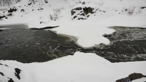 Winter river before spring in a bright winter forest. Mountain winter landscapes Video stock 151711556