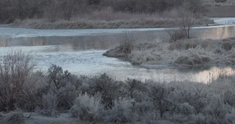 Winter River with Subtle Light in Frame Corner, Minimal Atmospheric Landscape, 7 Stockbeeldmateriaal 333265119