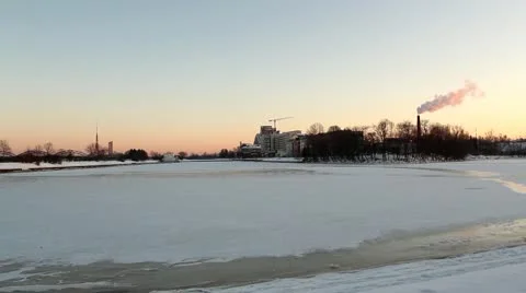 Winter river at sunset, with smoking chimney DNxHD Video stock 10737194
