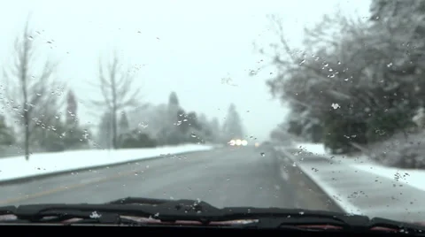 Winter Road - 10 - Traffic Througn Windshield With Moving Wipers In Snowfall Stock Footage