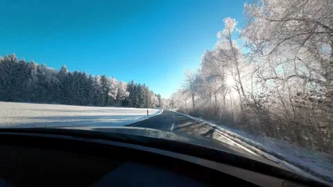 Winter road background. White trees in frost, blue sky and sun rays Stock Footage 308280726
