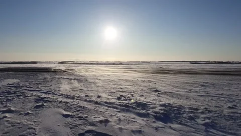 Winter road in a blizzard, blue sky, field in the snow Stock Footage 149032559