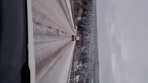 Winter Road Driving over Bridge Vertical Mobile first person driver snow ice Video stock 145944982