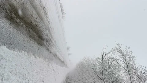 Winter road snowfall. Video stock 166856279