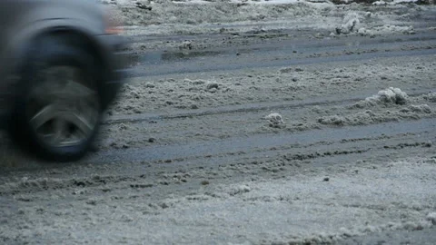 Winter road, spray from a passing car Stock Footage 227294841