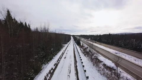 Winter Road Through Forest – Aerial FPV Flyover 스톡 동영상 321657669