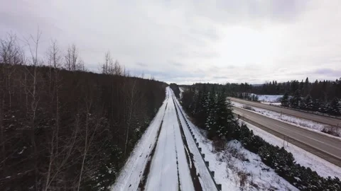 Winter Road Through Forest – Aerial FPV Flyover Stock Footage 321657686