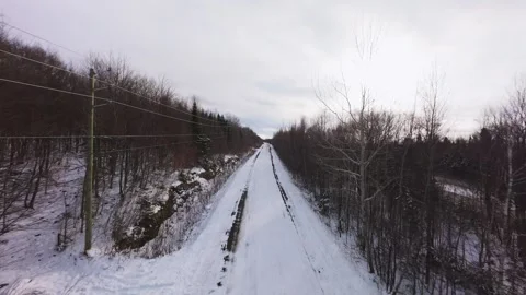 Winter Road Through Forest – Aerial FPV Flyover Stock Footage 321657728