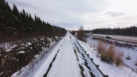 Winter Road Through Forest – Aerial FPV Flyover 스톡 동영상 321657951