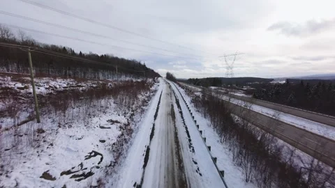 Winter Road Through Forest – Aerial FPV Flyover Stock Footage 321657998