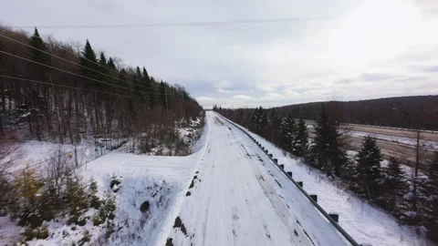 Winter Road Through Forest – Aerial FPV Flyover Stock Footage 321658088
