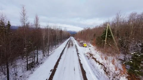 Winter Road Through Forest – Aerial FPV Flyover Stock Footage 321659540