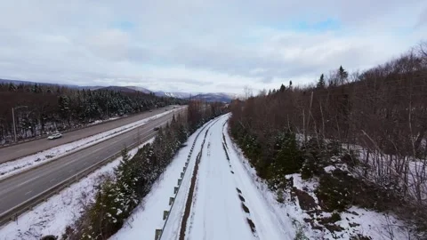 Winter Road Through Forest – Aerial FPV Flyover Stock Footage 321659622