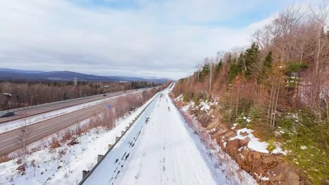 Winter Road Through Forest – Aerial FPV Flyover Stock Footage 321659713