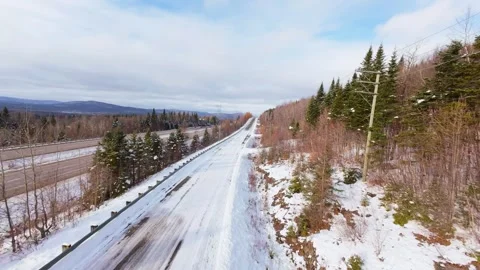 Winter Road Through Forest – Aerial FPV Flyover Stock Footage 321659727