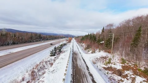 Winter Road Through Forest – Aerial FPV Flyover 스톡 동영상 321659801
