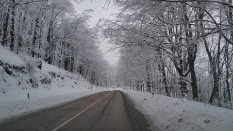 Winter road through the mountain Stock Footage 86127758
