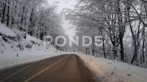 Winter road through the mountain