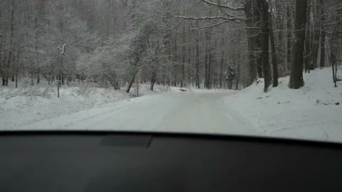 Winter road through snowy  forests. Car driving on snow road Video stock 148082853