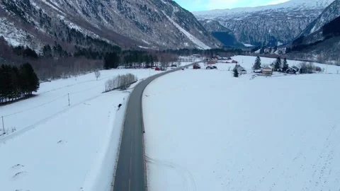 Winter Road Through Snowy Valley in More og Romsdal, Norway Stock Footage 315470307