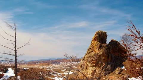 Winter rock and cloudy sky Stock Footage 10888509