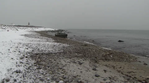 Winter rocky beach lighthouse Stock Footage 34528109
