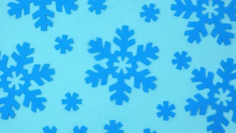 Winter rotating blue background with a pattern of decorative snowflakes. 4k. Stock Footage 219809870