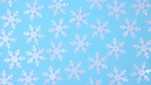 Winter rotating blue background with a pattern of decorative snowflakes. 4k. Stock Footage 219927986