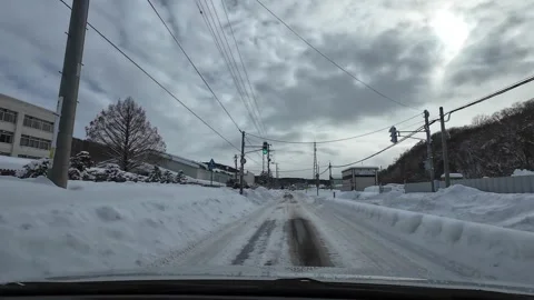 Winter rural driving through intersection with traffic Sapporo Japan Video stock 333204829