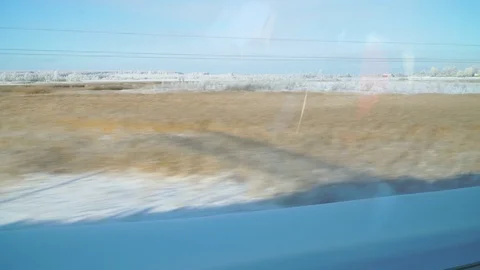 Winter Russian plain from the window of a moving train Stock Footage 104662161