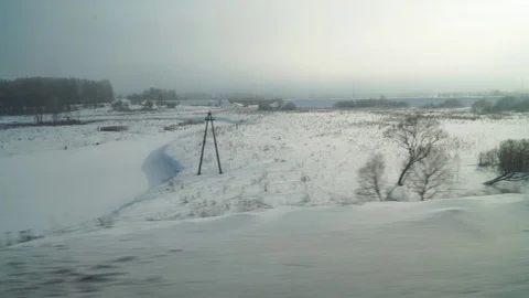 Winter Russian plain from the window of a moving train Stock Footage 104662195