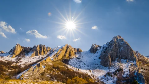 Winter scene, mountain chain under a sparkle sun time lapse scene Vídeos de archivo 288065335