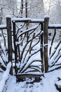 Winter scene of an old timber gate and rustic fence in Central Park Stock Photos