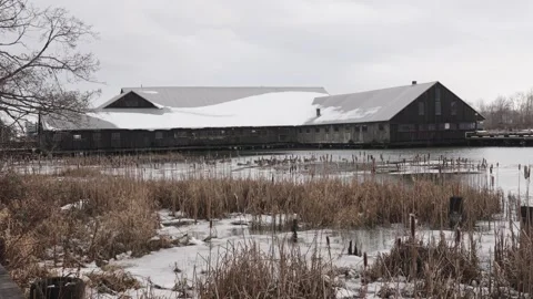Winter Scene with Snow-Covered Barn and Frozen Pond Stock-Footage 271199681
