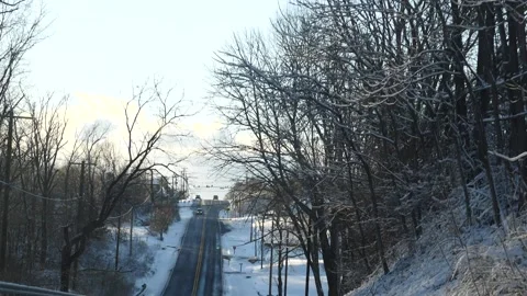 Winter scene with snow covered road thriugh the suburbs Video stock 171908432