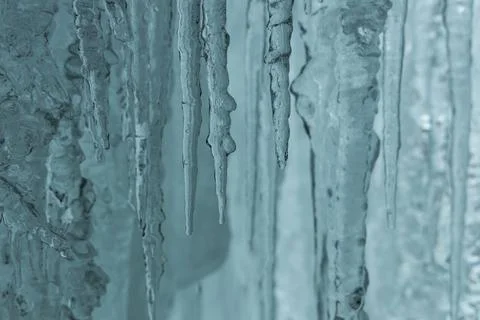 Winter Scenery inside the frozen waterfall. Sharp details: clear ice. Stock Photos