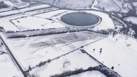 Winter Scenery with a Large Round Water Reservoir Stock-Footage 325575317
