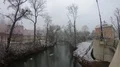 Winter scenery river with trees and buildings with fall of snow in Braunschweig 4k or 4k+ Resolution