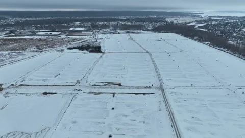 Winter scenery shows white ground and shadowy city outline 動画素材 327806791