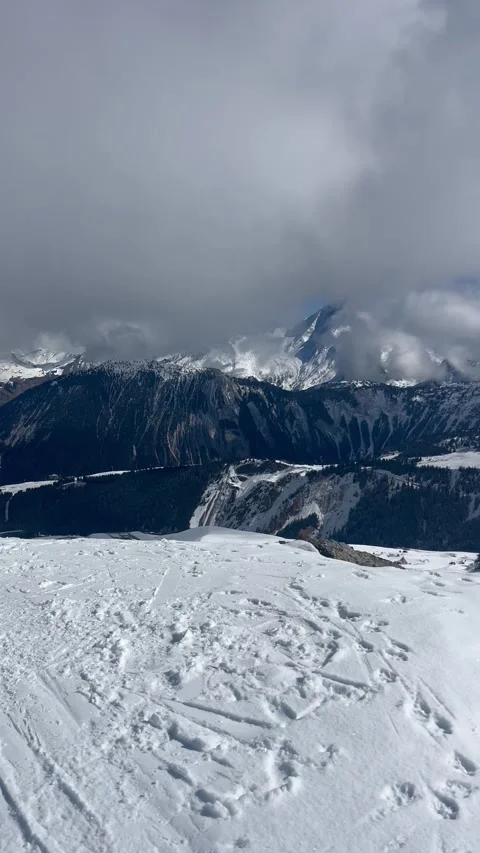Winter scenery by skiing at edge of a cliff in French alps under snow Stock Footage 337091422