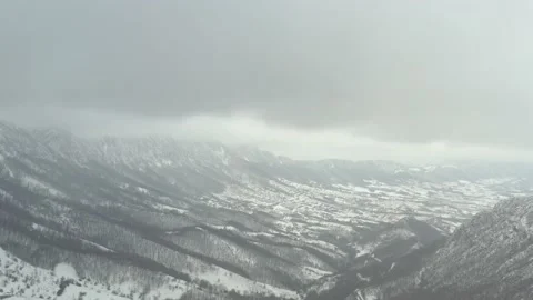 Winter scenery with snowed valley in Eastern Serbia 4K drone video Stock Footage 102773970
