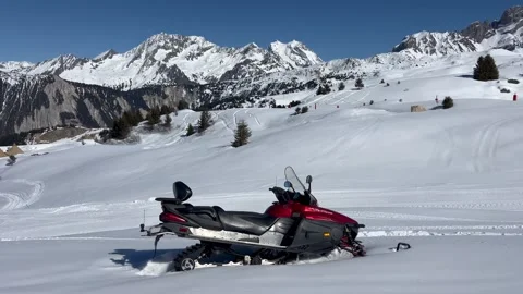 Winter scenery with a snowmobile on snowcapped mountain Stock Footage 337092855