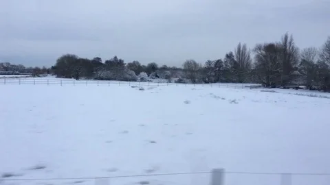 Winter Scenes pass by rapidly as a train travels along the track Stock-Footage 84676660