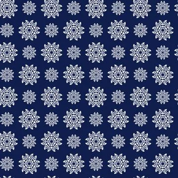 Winter seamless pattern with white snowflakes on blue background. Vector Stockillustratie