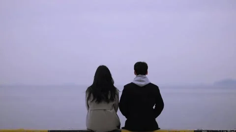 Winter seaside, a couple's back view 動画素材 249900462