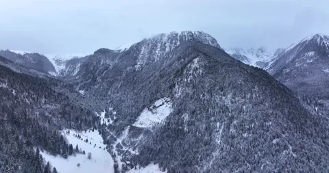 Winter shooting a mountain peak. Panoramic drone shot of beautiful scenery Stock Footage 205096743